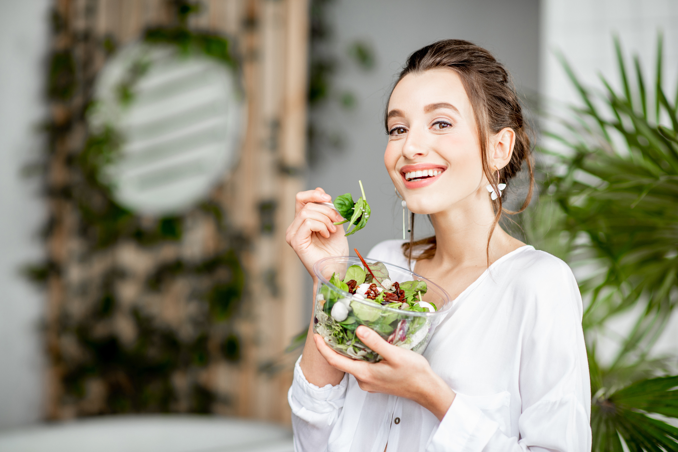 Woman Eating Green Salad 