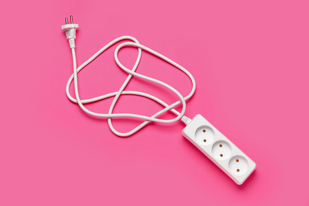 Electric Extension Cord on Pink Background