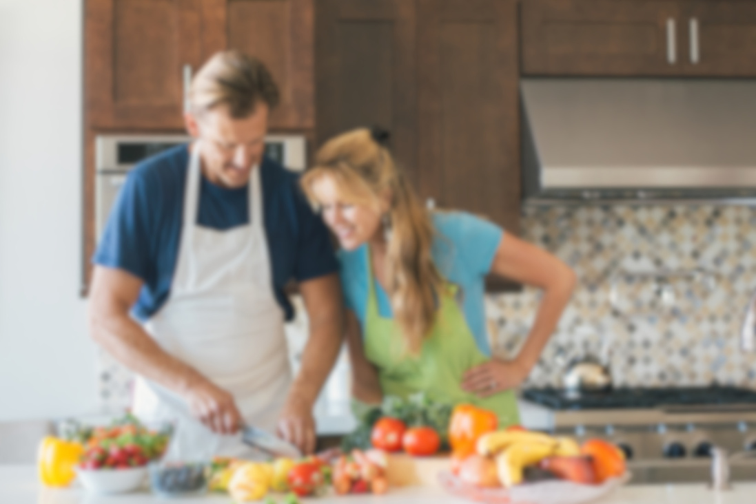 Husband and wife cooking together