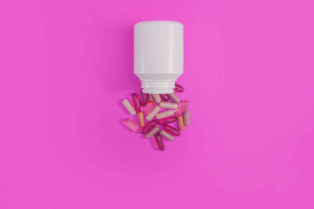 Pills And Capsules From A White Bottle 